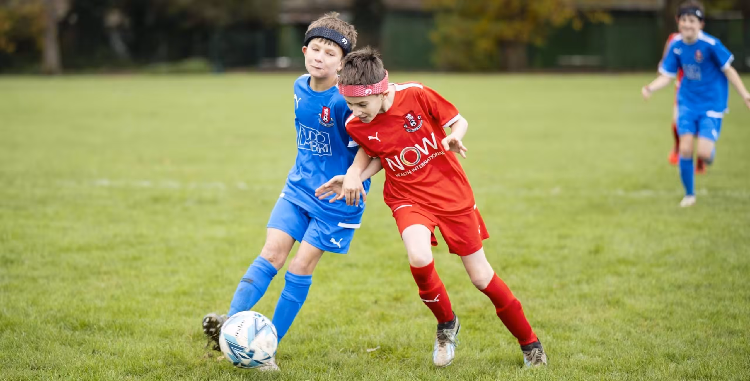 Youth footballers wearing Rezon Halos® during play