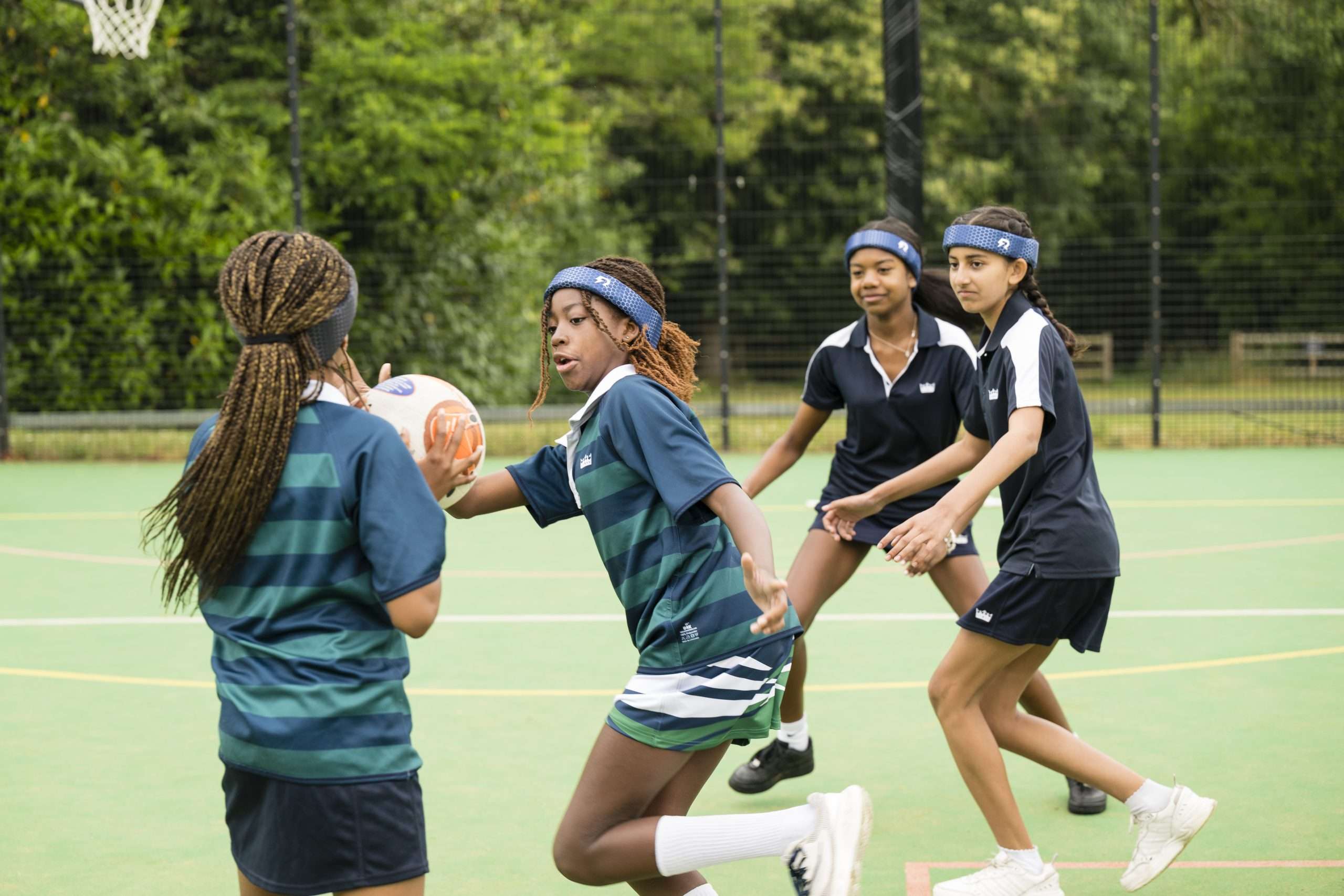 Netball players wearing Rezon Halos® concussion protection.