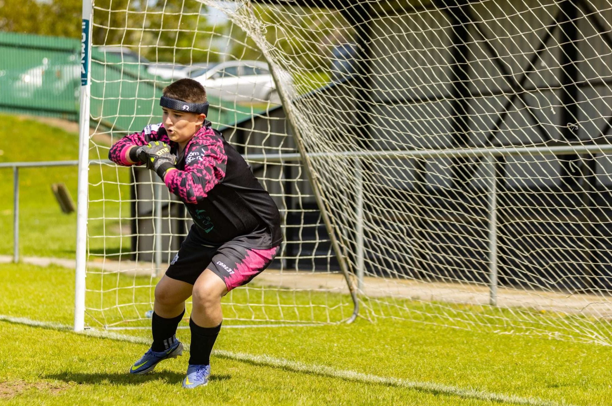 A youth football goalkeeper wearing Rezon Halos®.