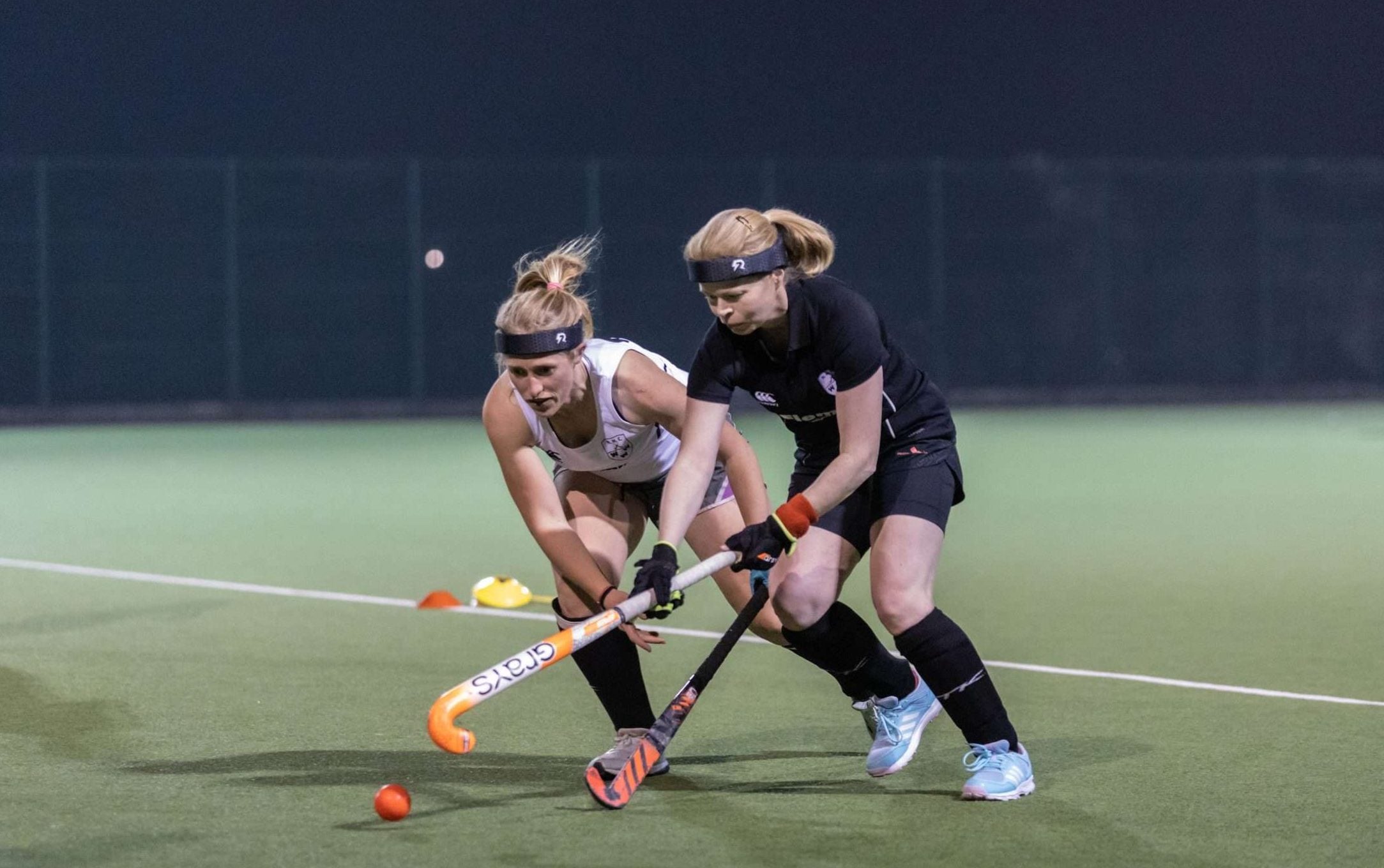 Rezon Halos® brain protection being worn in field hockey training.