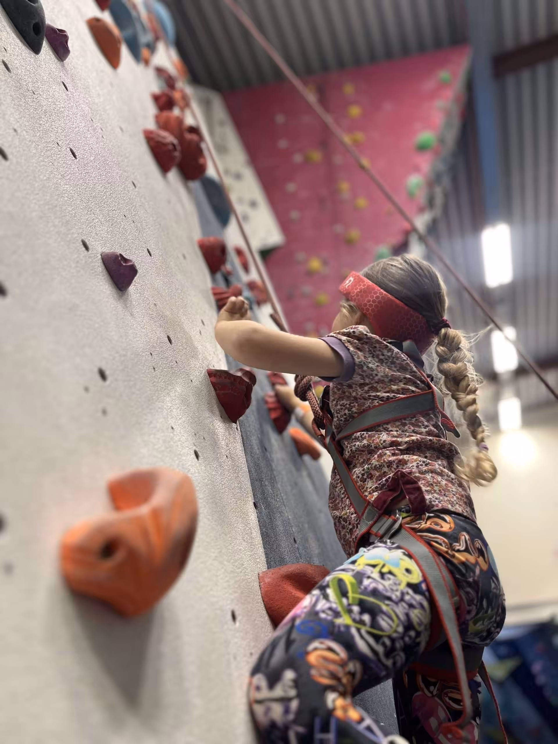 Rezon Halos® concussion protection worn for indoor top-rope climbing.