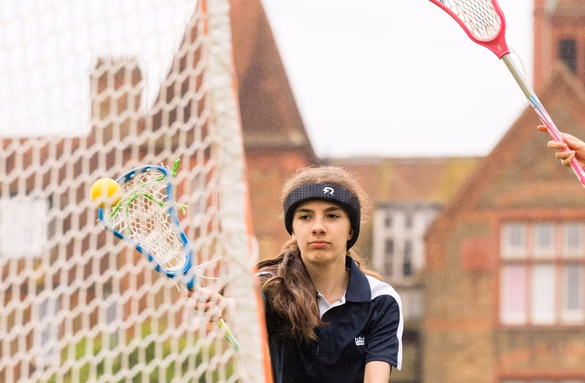 A Lacrosse player wearing Rezon Halos® concussion protection.
