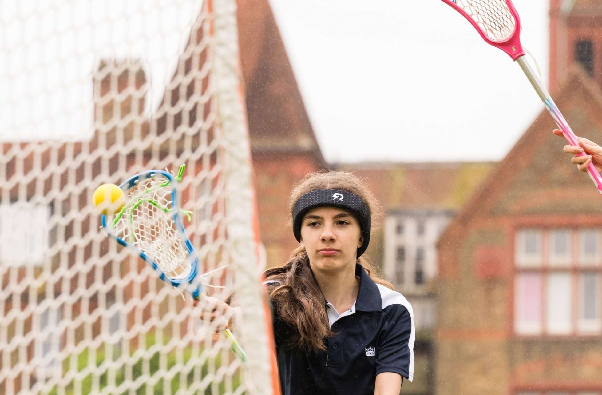 A Lacrosse player wearing Rezon Halos® concussion protection.
